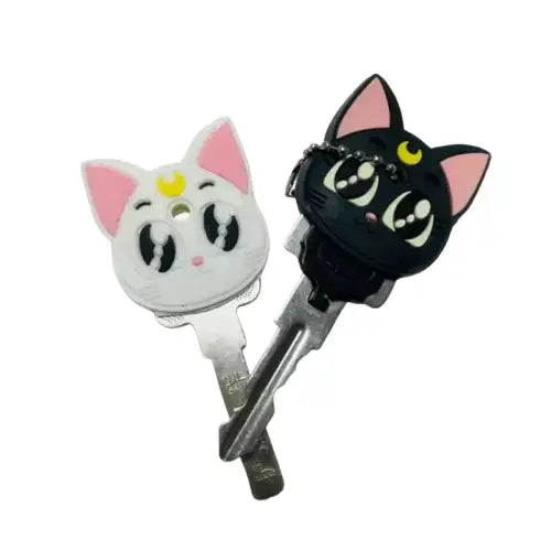Lot de 2 porte-clés en silicone en forme de chat avec des yeux jaunes - Adorable design noir et blanc Transparent Background