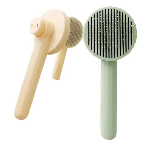 Peigne à chat pour enlever en douceur les poils morts, design ergonomique sur fond rose Transparent Background