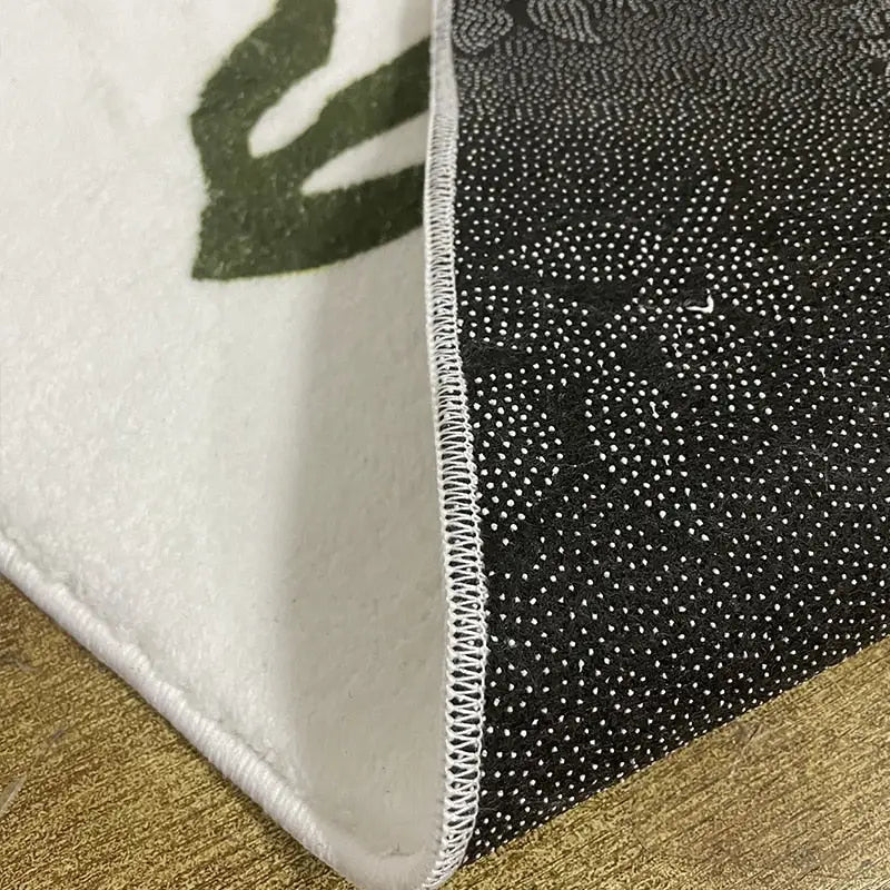 Tapis de sol en forme de chat - Tapis noir et blanc avec un motif ludique et une bordure blanche